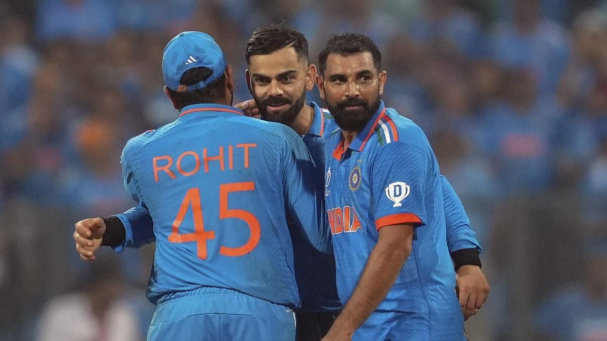 <div class="paragraphs"><p>Captain Rohit Sharma, Virat Kohli, Mohammed Shami and Jasprit Bumrah celebrate after winning the ICC Men's Cricket World Cup 2023 first semi-final match against New Zealand, at the Wankhede Stadium, in Mumbai, Wednesday, Nov. 15, 2023. </p></div>