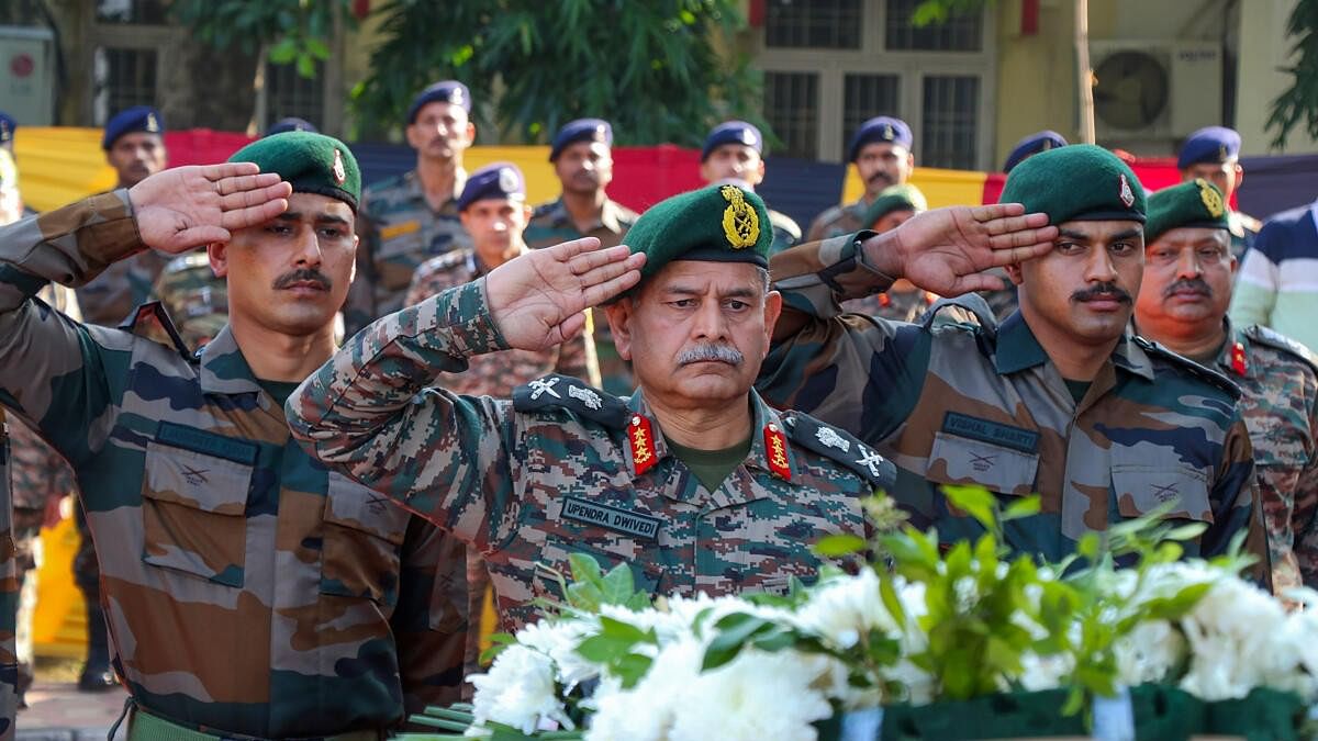 <div class="paragraphs"><p>General Officer Commanding-in-Chief Northern Command of Army Lt General Upendra Dwivedi pays homage to martyrs killed in an encounter with terrorists in Rajouri district, during a wreath laying ceremony, in Jammu.</p></div>