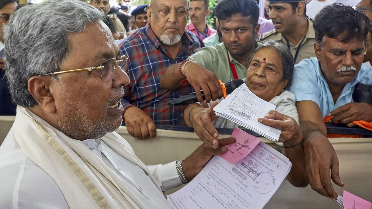 <div class="paragraphs"><p>Karnataka Chief Minister Siddaramaiah listens to grievances of the general public during 'Janata Darshan' programme at his office, in Bengaluru.</p></div>