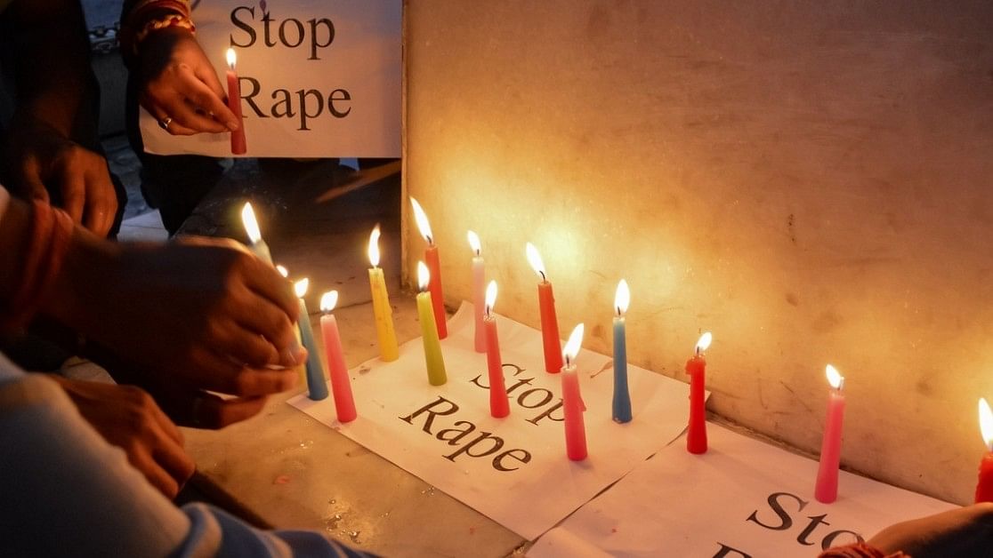 <div class="paragraphs"><p>Representative image of people lighting candle to protest crime against women, children. </p></div>