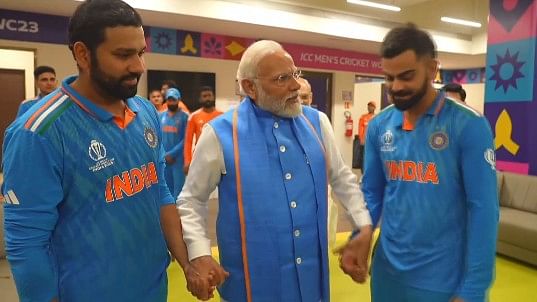 <div class="paragraphs"><p>PM Modi with Rohit Sharma and Virat Kohli.</p></div>