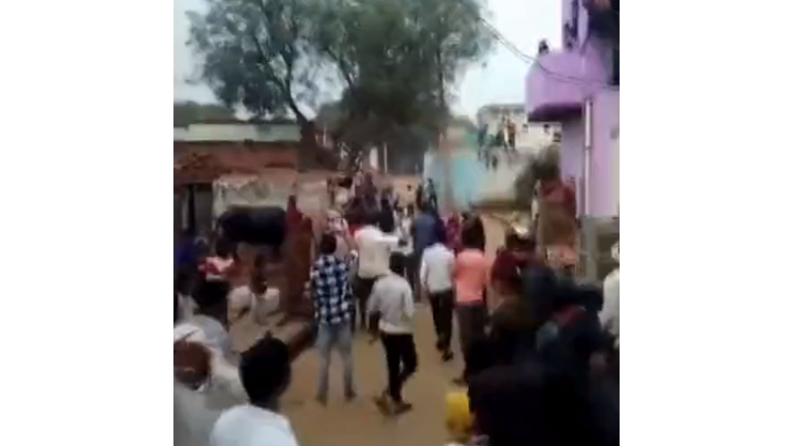 <div class="paragraphs"><p>A screengrab from the video showing people pelting stones at each other.</p></div>