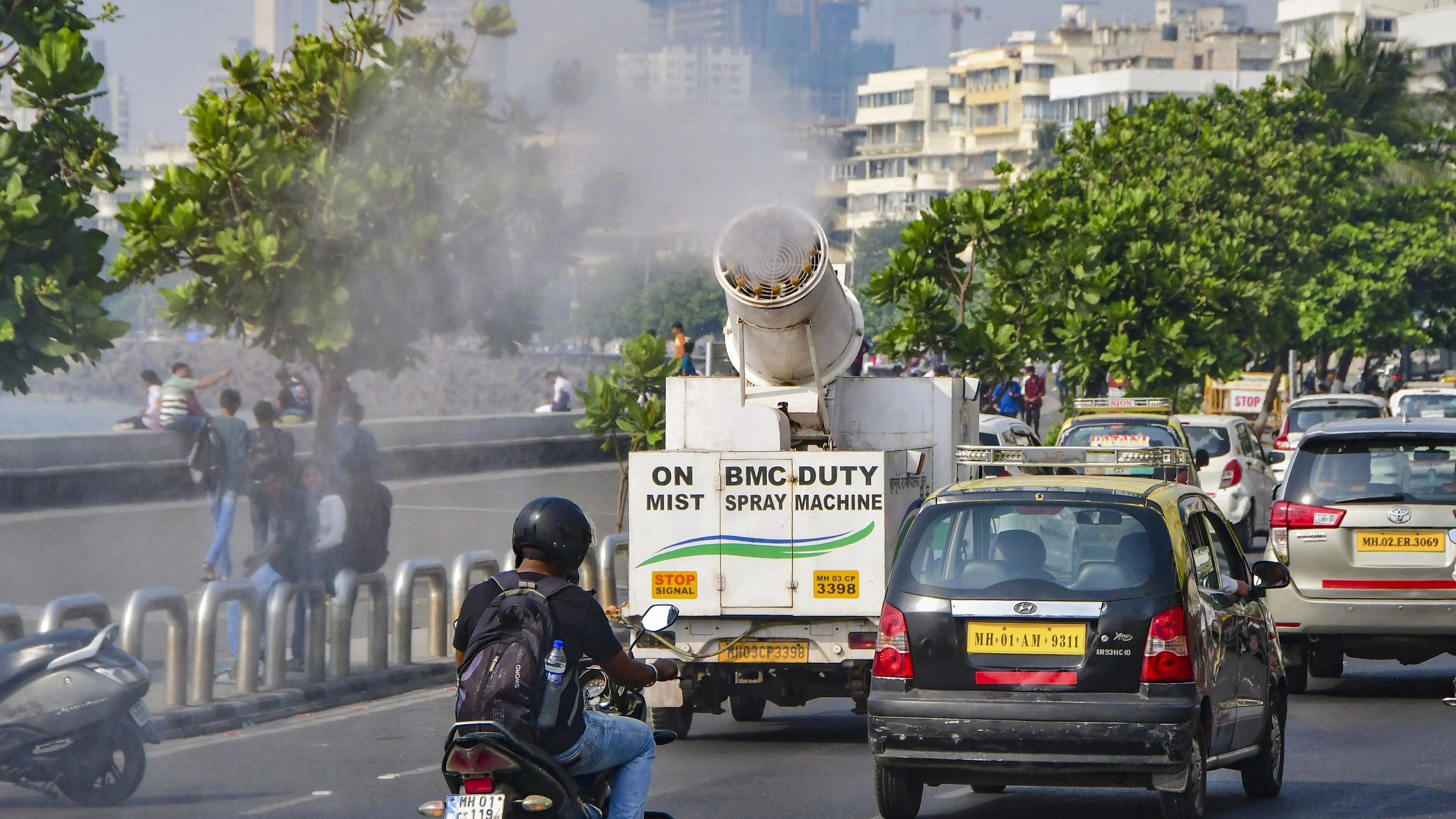 <div class="paragraphs"><p>BMC workers use a mist spray machine to mitigate bad air quality, at Marine Drive, in Mumbai.</p></div>