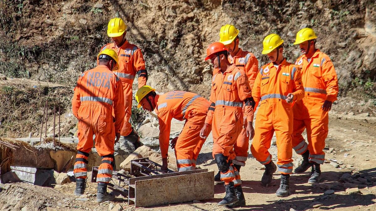 <div class="paragraphs"><p>NDRF personnel at the under-construction tunnel between Silkyara and Dandalgaon on the Brahmakhal-Yamunotri national highway, days after a portion of the tunnel collapsed trapping several workers inside, in Uttarkashi district, Tuesday, Nov. 21, 2023.</p></div>