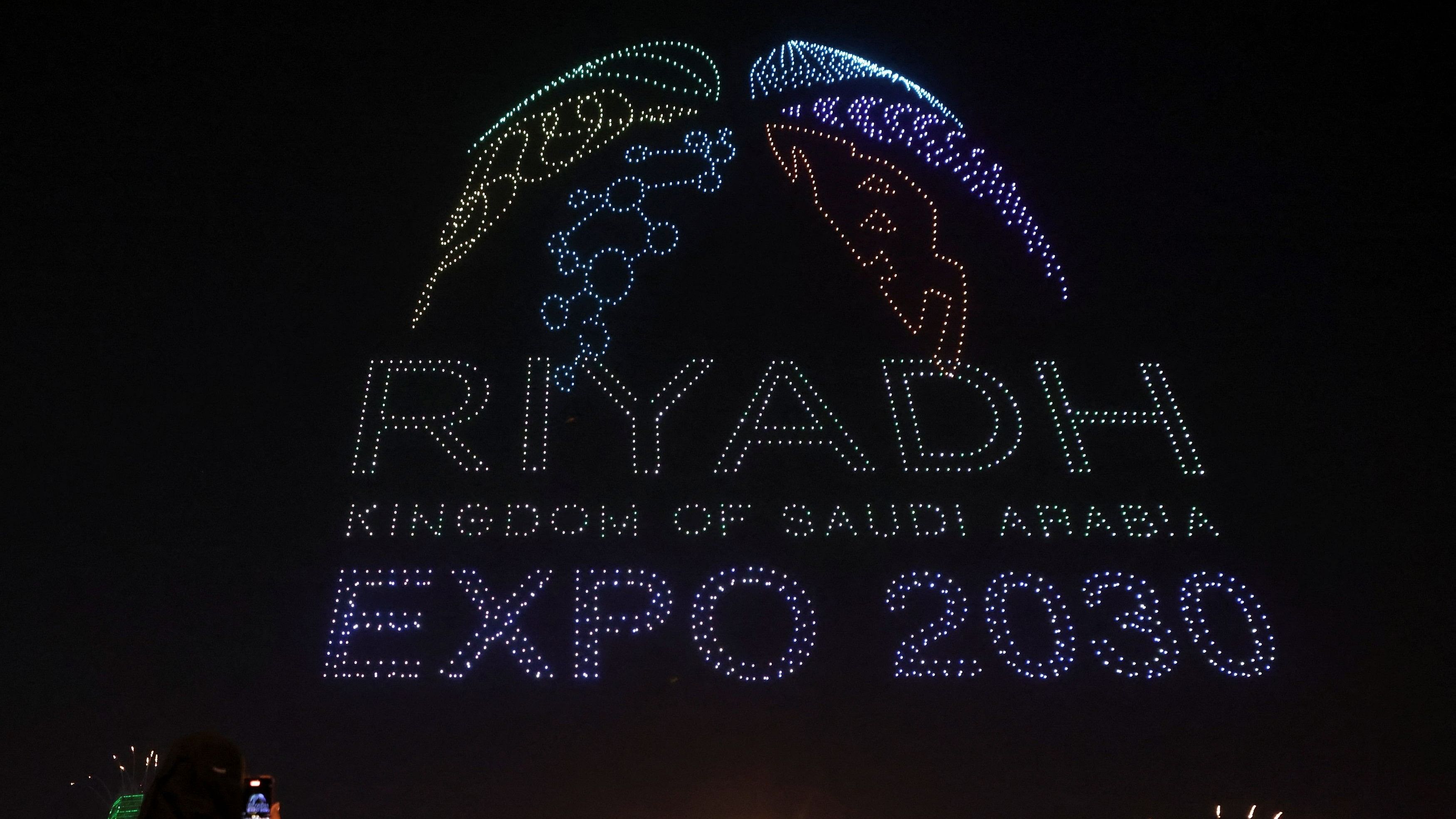 <div class="paragraphs"><p>People watch fireworks and a light show, as Saudi Arabia celebrates winning its bid to host the World Expo 2030, in Riyadh.</p></div>