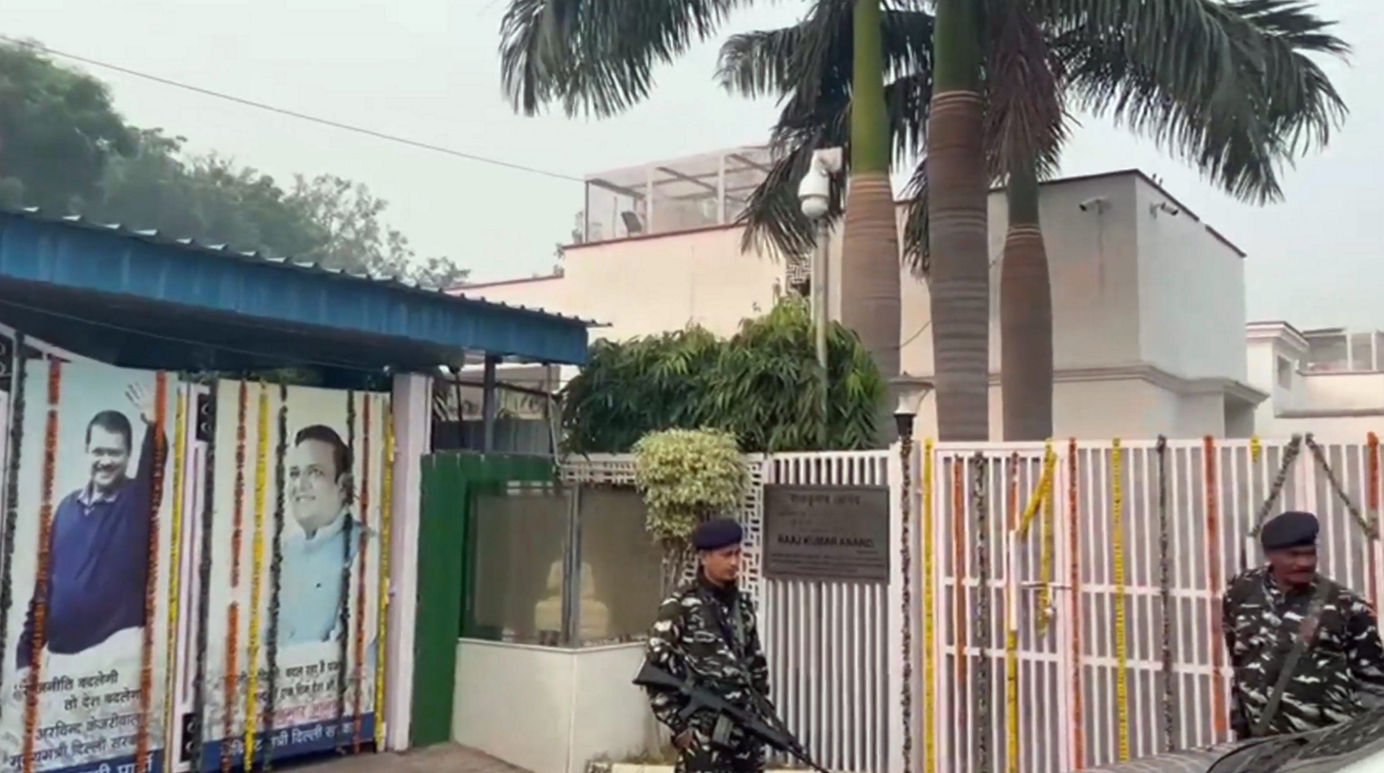<div class="paragraphs"><p> Security personnel stand guard outside the premises of Delhi Cabinet Minister and AAP leader Raaj Kumar Anand during a raid by Enforcement Directorate officials, in New Delhi, Thursday, Nov. 2, 2023. </p></div>