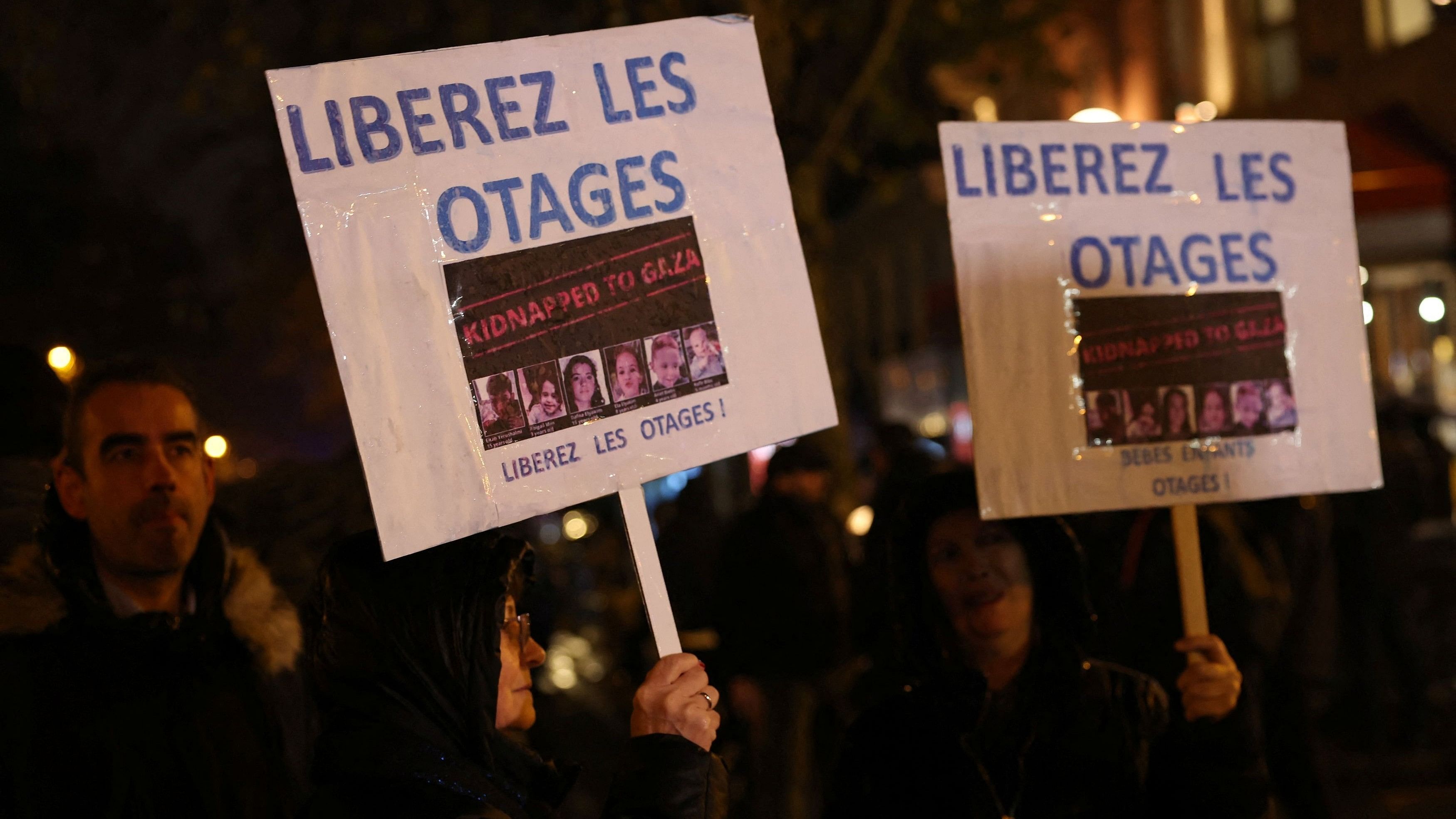 <div class="paragraphs"><p>People hold placards which reads "Free the hostages" during a demonstration against antisemitism.</p></div>