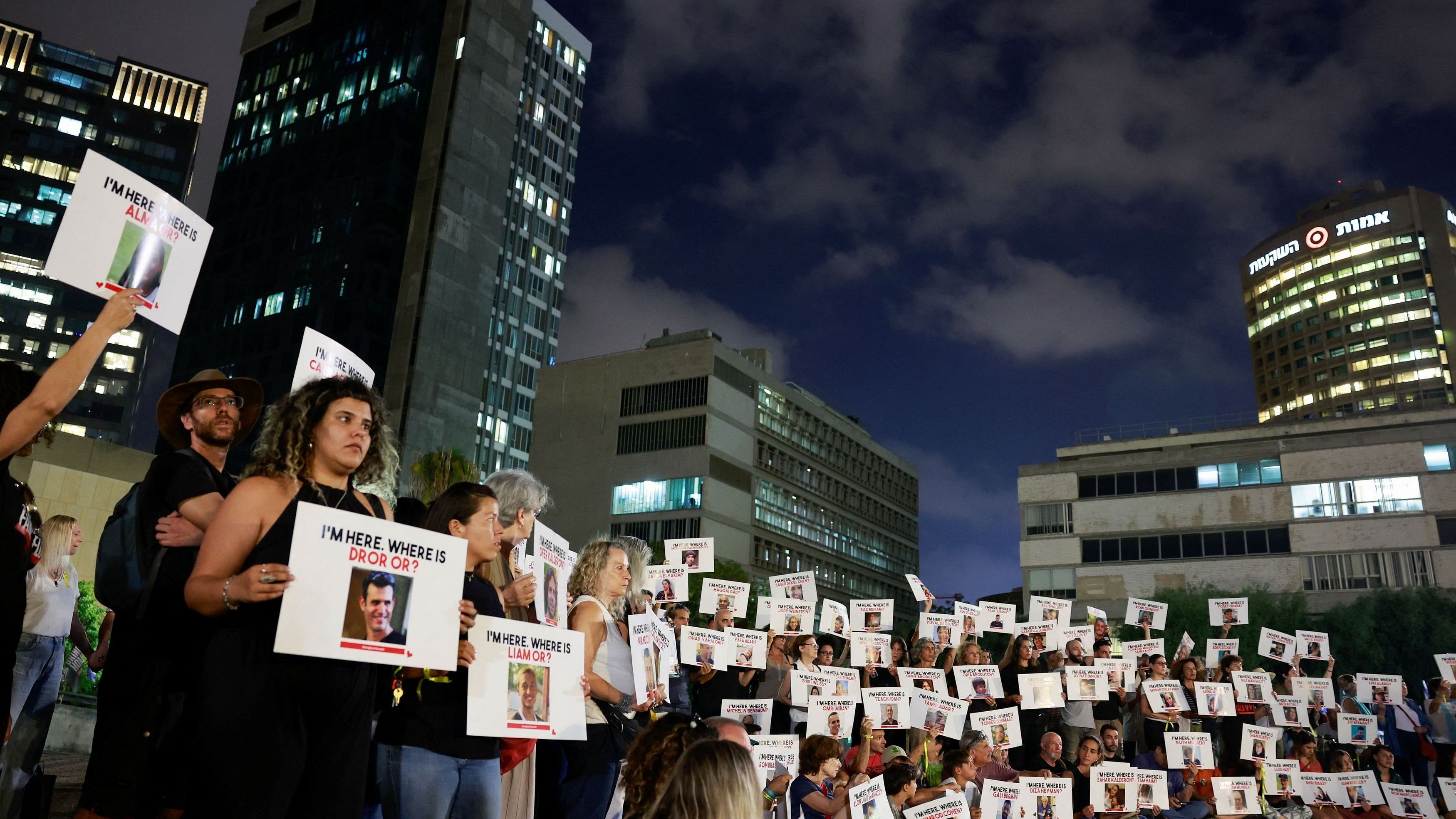 <div class="paragraphs"><p>Members of the kibbutz community of Kfar Aza hold banners during a demonstration in support of the families of hostages held in Gaza, who were seized in the deadly October 7 attack by Hamas gunmen, in Tel Aviv, Israel November 2, 2023. </p></div>