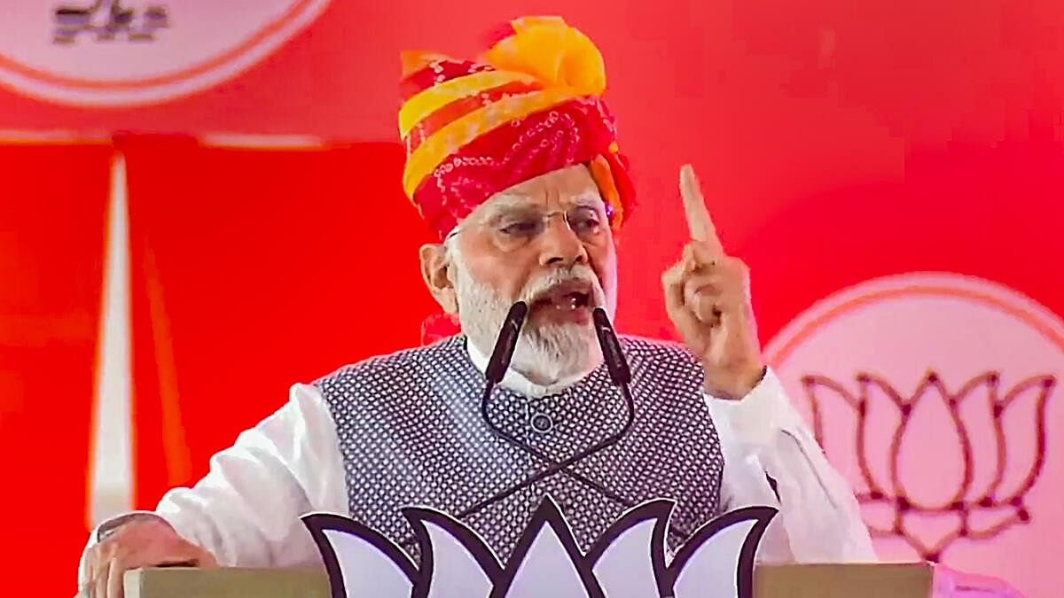 <div class="paragraphs"><p>Prime Minister Narendra Modi speaks during a public meeting ahead of Rajasthan Assembly elections, at Baytu in Barmer district, Wednesday, Nov. 15, 2023.</p></div>