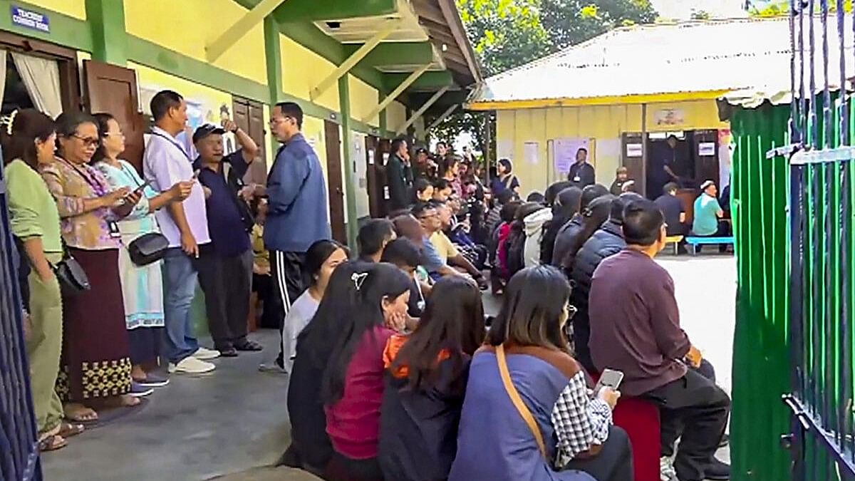 <div class="paragraphs"><p>Voters wait at a polling station to cast their votes for Mizoram Assembly elections, in Aizawl.&nbsp;</p></div>