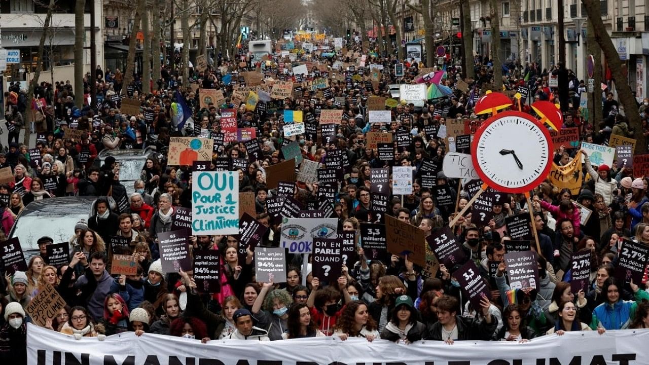 <div class="paragraphs"><p>Protesters march in Paris to urge governments to act against climate change and social injustice.</p></div>