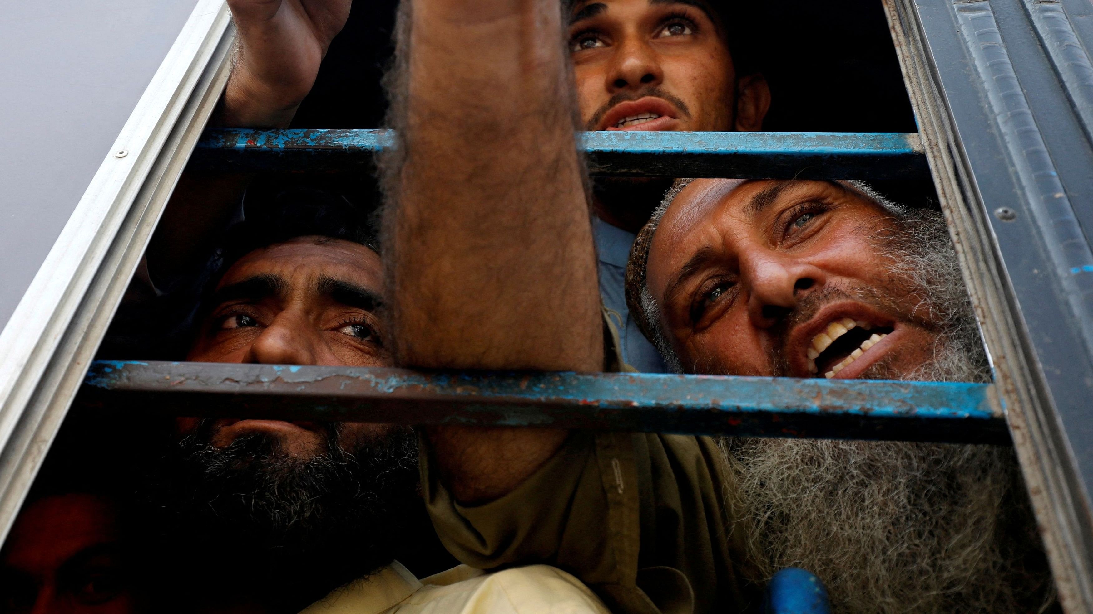 <div class="paragraphs"><p>Afghan nationals, who according to police were undocumented, speak to the members of the media from the window of a bus, as they were detained and shift to a temporary holding centre, after Pakistan gave the last warning to undocumented migrants to leave, in Karachi, Pakistan November 2, 2023. </p></div>