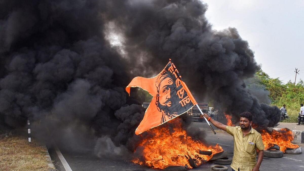<div class="paragraphs"><p>Maratha Kranti Morcha activists burn tyres and other inflamable items during a protest on Pune-Solapur Highway to press for Maratha reservation, in Solapur.</p></div>