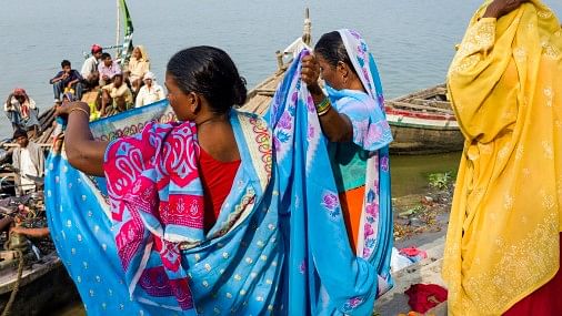 <div class="paragraphs"><p>Women by river Ganges in Bihar.</p></div>