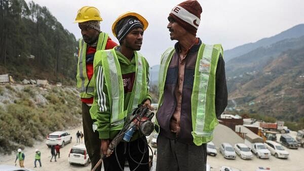 <div class="paragraphs"><p>"Rat miners" stand before they begin manual drilling as rescue operations are in progress after workers got trapped in a collapse of an under-construction tunnel, in Uttarkashi in the northern state of Uttarakhand.</p></div>