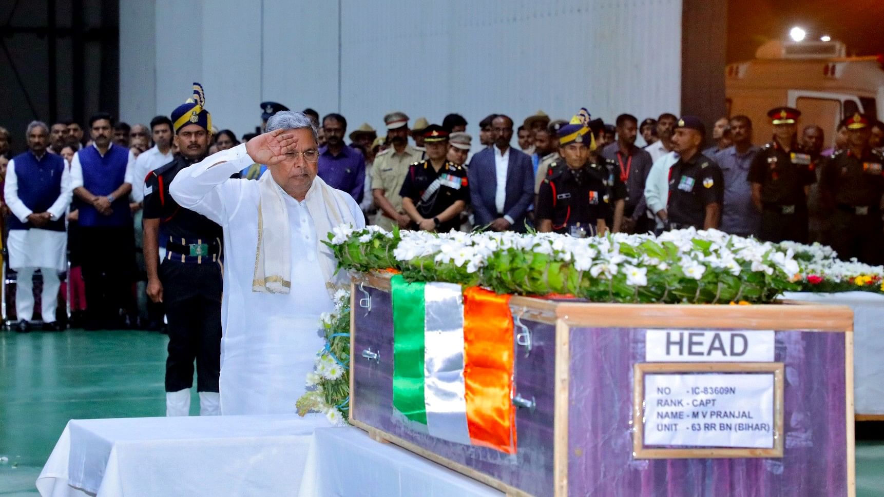 <div class="paragraphs"><p>Karnataka Governor Thawar Chand Gehlot, Chief Minister Siddaramaiah and Minister KJ George paid their last respects to martyr Pranjal at HAL Airport after his remains arrived here.</p></div>