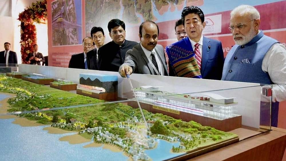 <div class="paragraphs"><p>The total cost of Mumbai-Ahmedabad High Speed Rail Corridor project is pegged at Rs 1.08 lakh crore.</p></div>