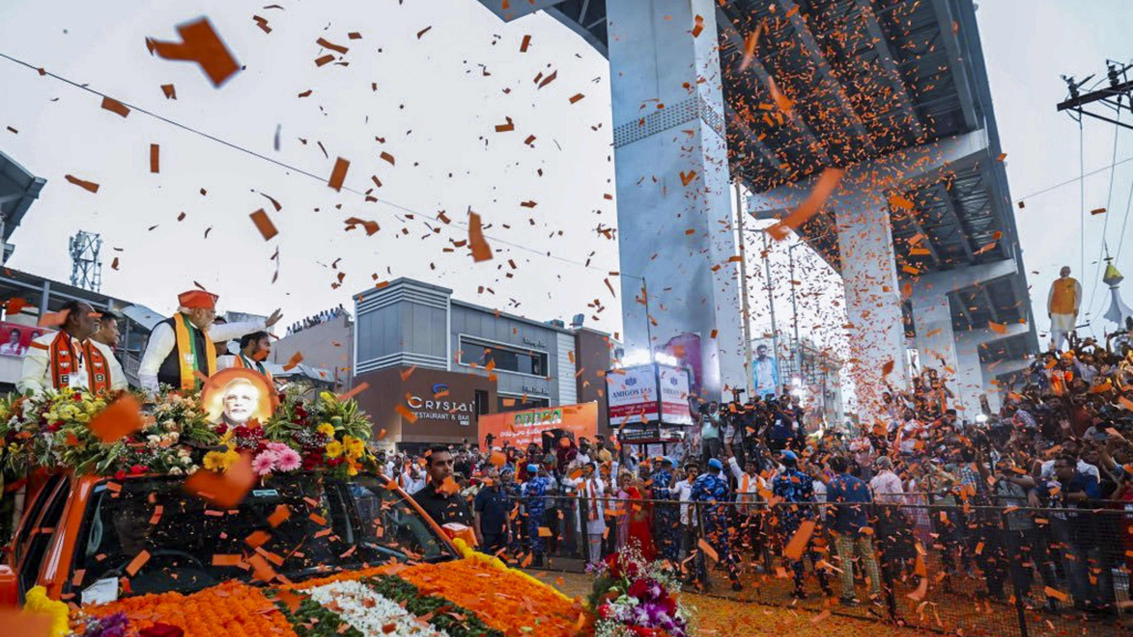 <div class="paragraphs"><p> Prime Minister Narendra Modi with Telangana BJP chief and Union Minister G. Kishan Reddy and MP K. Laxman during a road show ahead of the Telangana Assembly election, in Hyderabad, Monday, Nov. 27, 2023.</p></div>