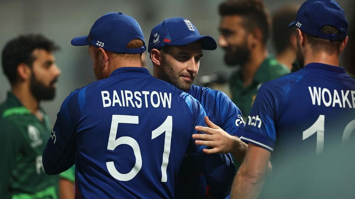 <div class="paragraphs"><p>England's Mark Wood, Jonny Bairstow and Chris Woakes react after the match.</p></div>