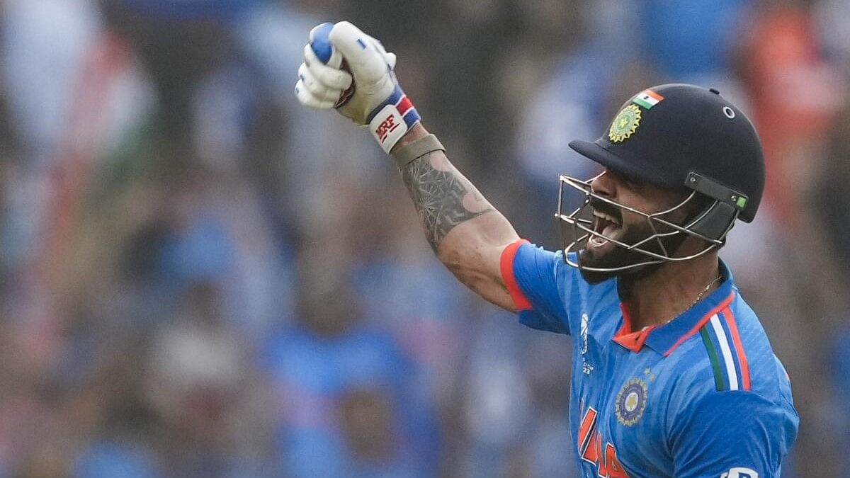 <div class="paragraphs"><p>India's Virat Kohli celebrates his 50th century, breaking Sachin Tendulkar's most ODI hundreds record, during the ICC Men's Cricket World Cup 2023 semi-final match between India and New Zealand, at the Wankhede Stadium, in Mumbai, Wednesday, Nov. 15, 2023.</p></div>