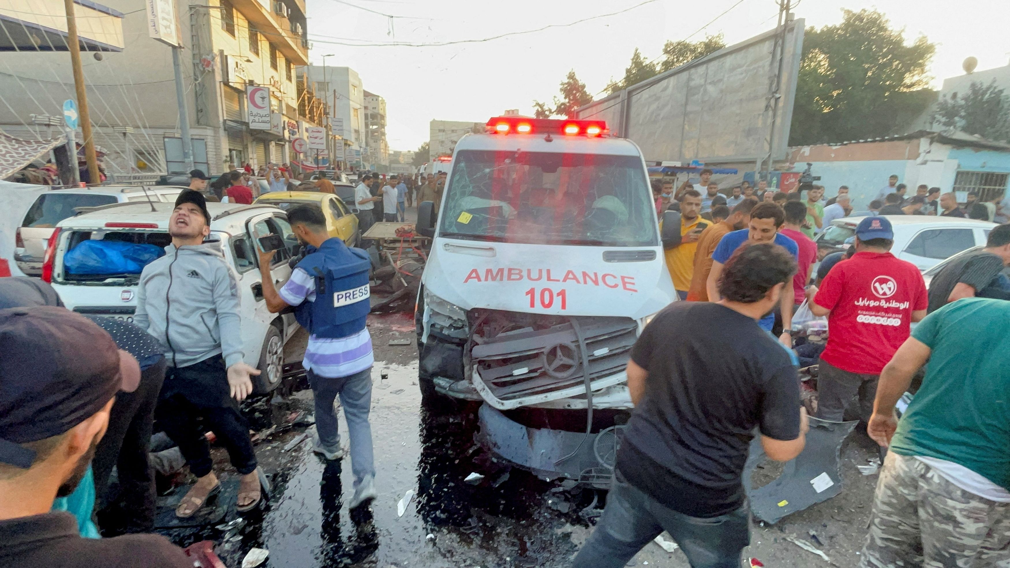 <div class="paragraphs"><p>Palestinians check the damages after a convoy of ambulances was hit, at the entrance of Shifa hospital in Gaza City, November 3, 2023. </p></div>