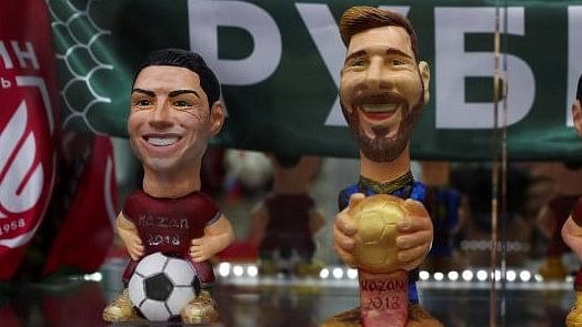 <div class="paragraphs"><p>Figures depicting Argentina's star Lionel Messi and Portugal's star Cristiano Ronaldo are displayed for sale inside a souvenirs shop in Kazan, Russia, June 20, 2018.</p></div>