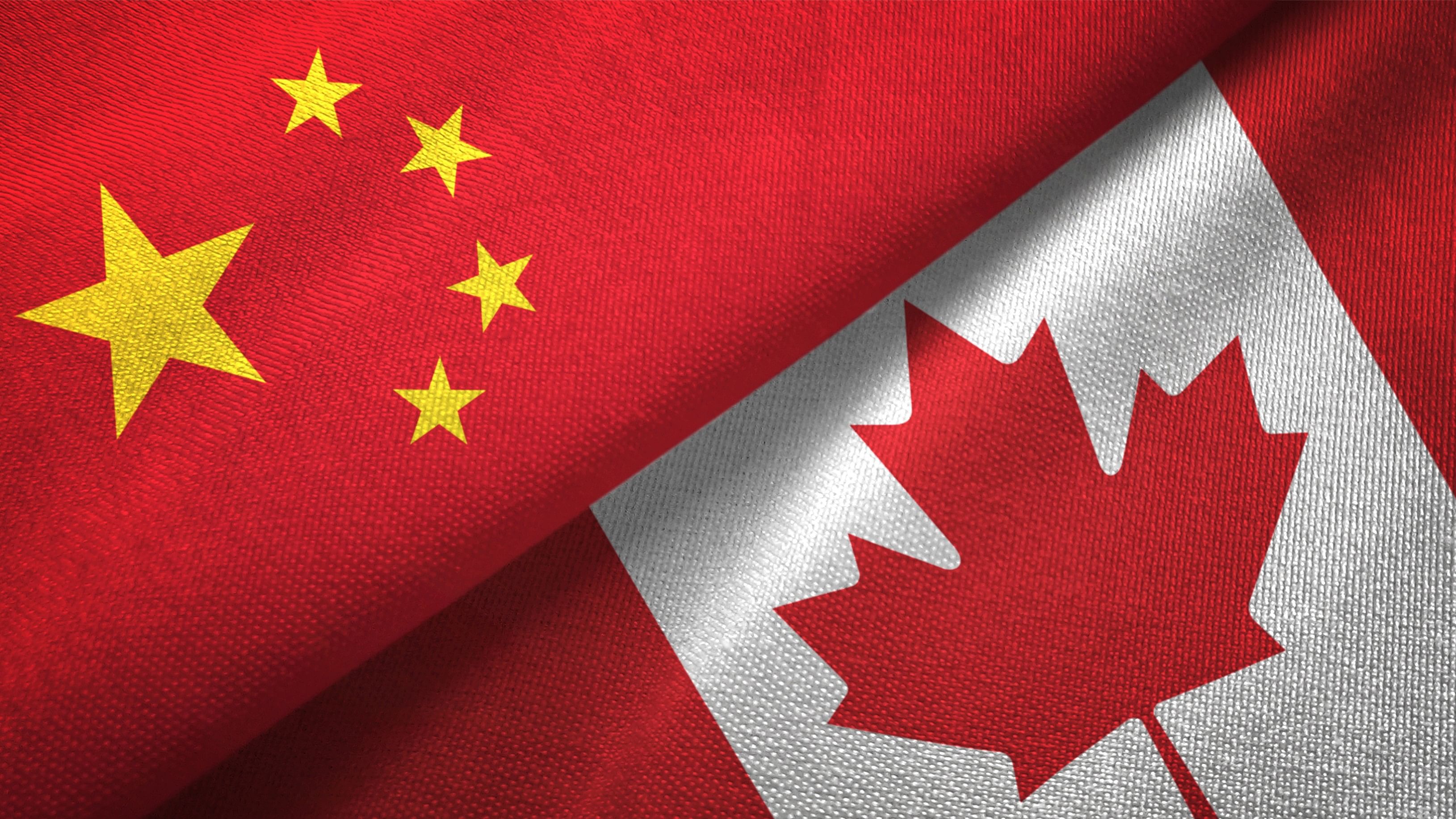 <div class="paragraphs"><p>Flags of China and Canada.</p></div>