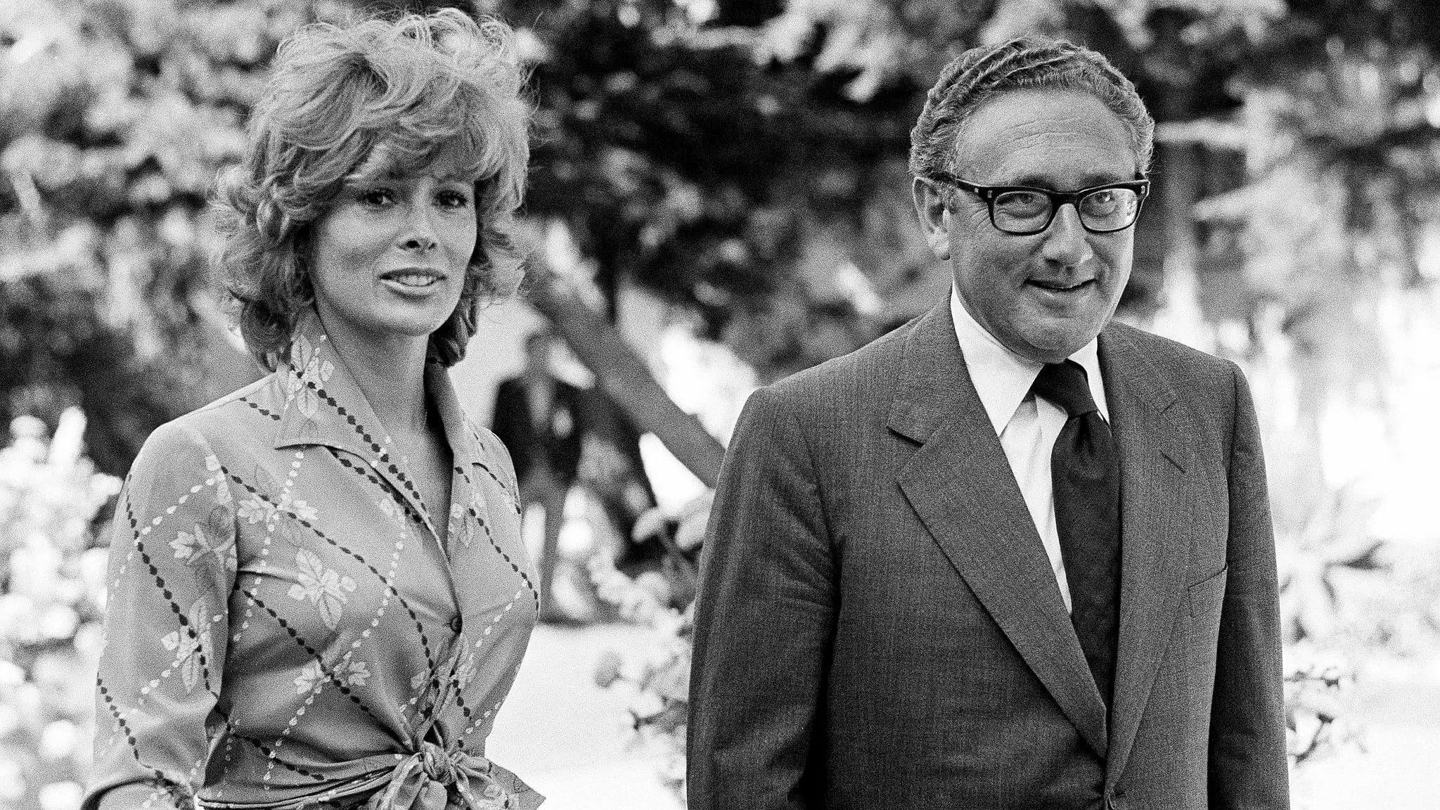 <div class="paragraphs"><p>Jill St John (left) is the first American Bond girl in the James Bond movie franchise, and appeared in 'Diamonds are Forever'. She is pictured with Henry Kissinger (right). The two, despite being romantically linked, denied any such relationship.</p></div>
