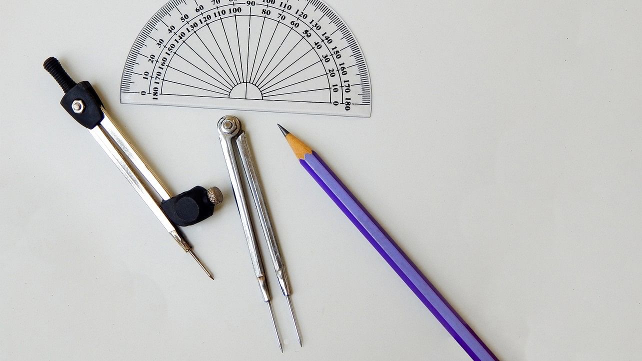 <div class="paragraphs"><p>Representative image showing a divider, compass, protractor, and pencil.</p></div>