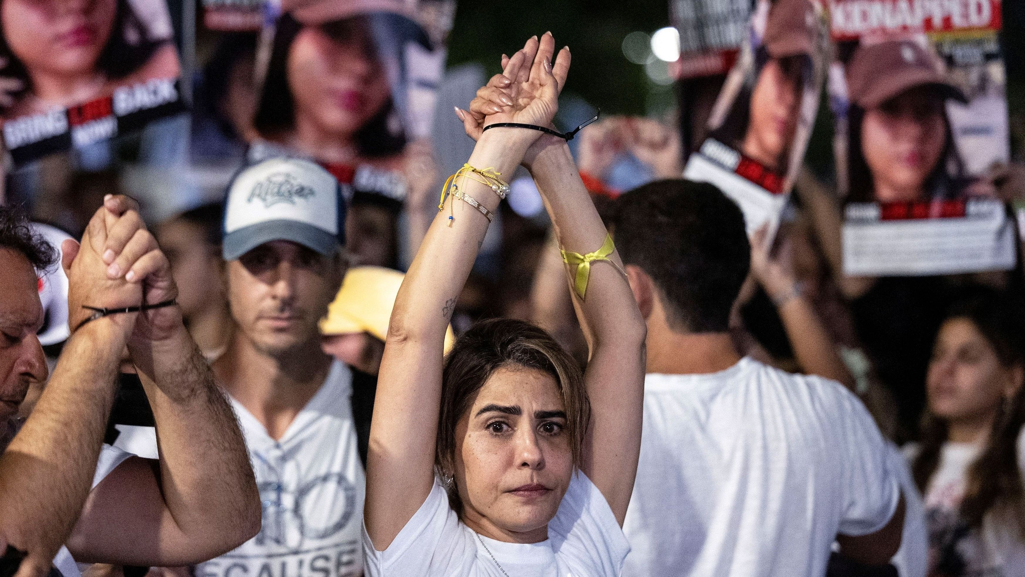 <div class="paragraphs"><p>A woman raises her arms during a protest to demand the immediate release of hostages held in Gaza who were seized in the October attack by Hamas gunmen, in Tel Aviv, Israel, November 4, 2023. </p></div>