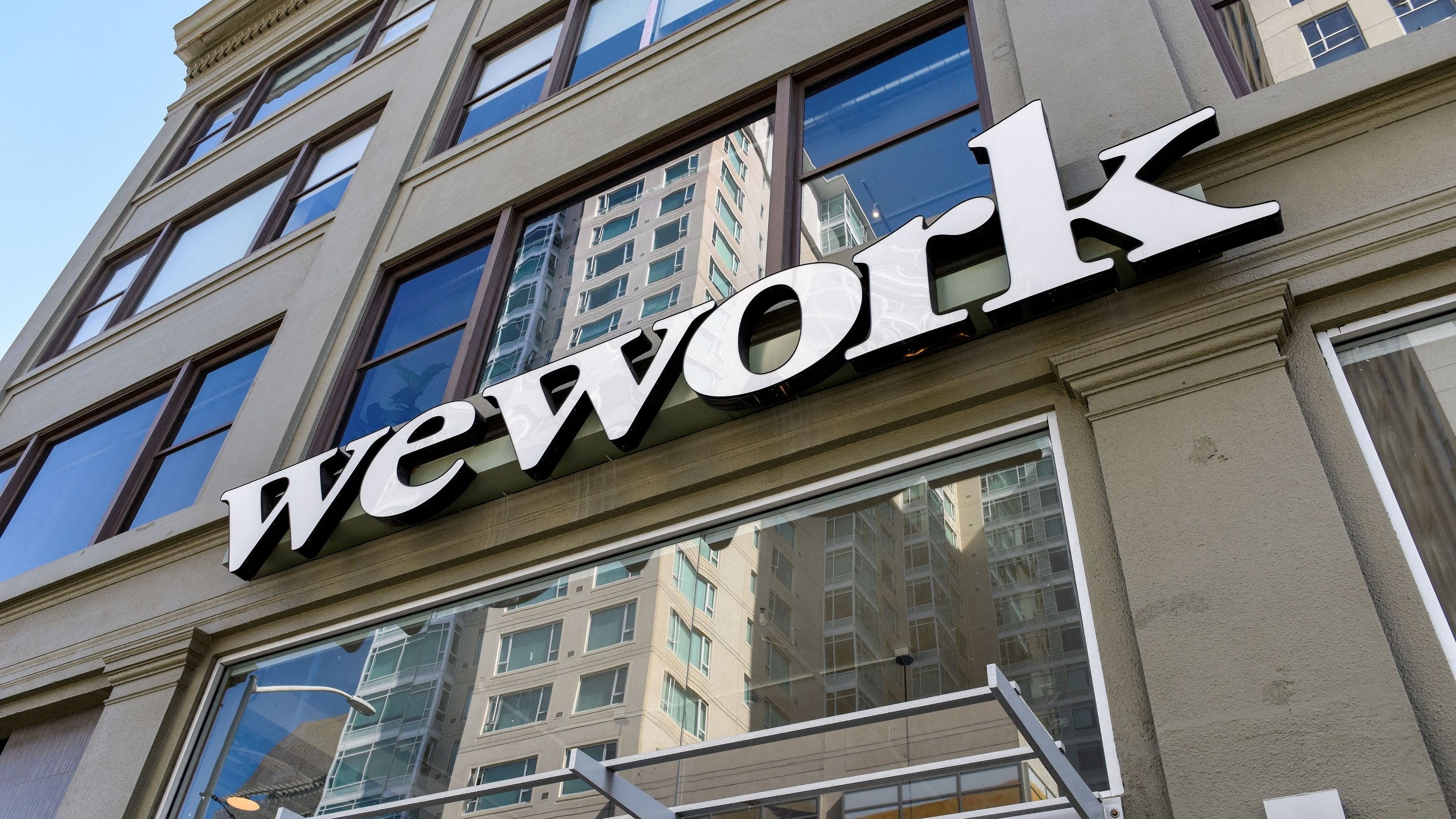 <div class="paragraphs"><p>A WeWork logo is seen outside its offices in San Francisco, California, US.</p></div>