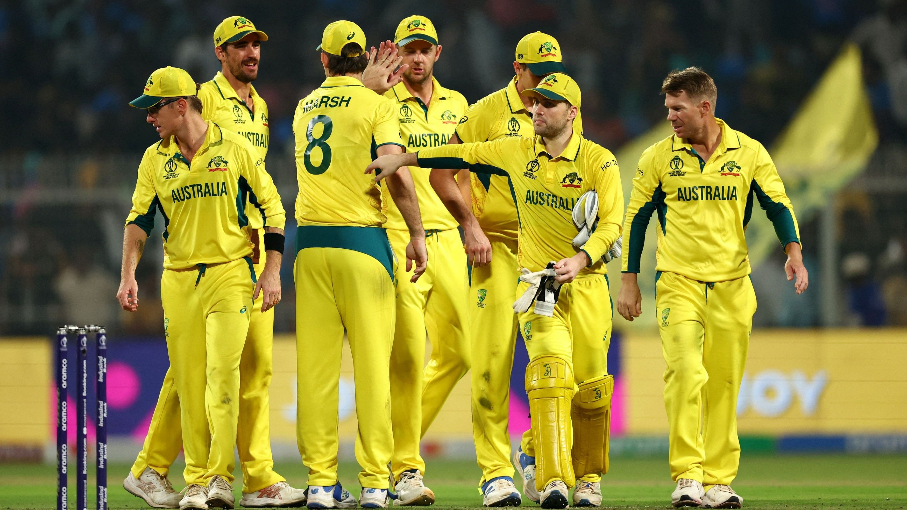 <div class="paragraphs"><p>Pat Cummins celebrates with teammates after taking the wicket of South Africa's Kagiso Rabada</p></div>