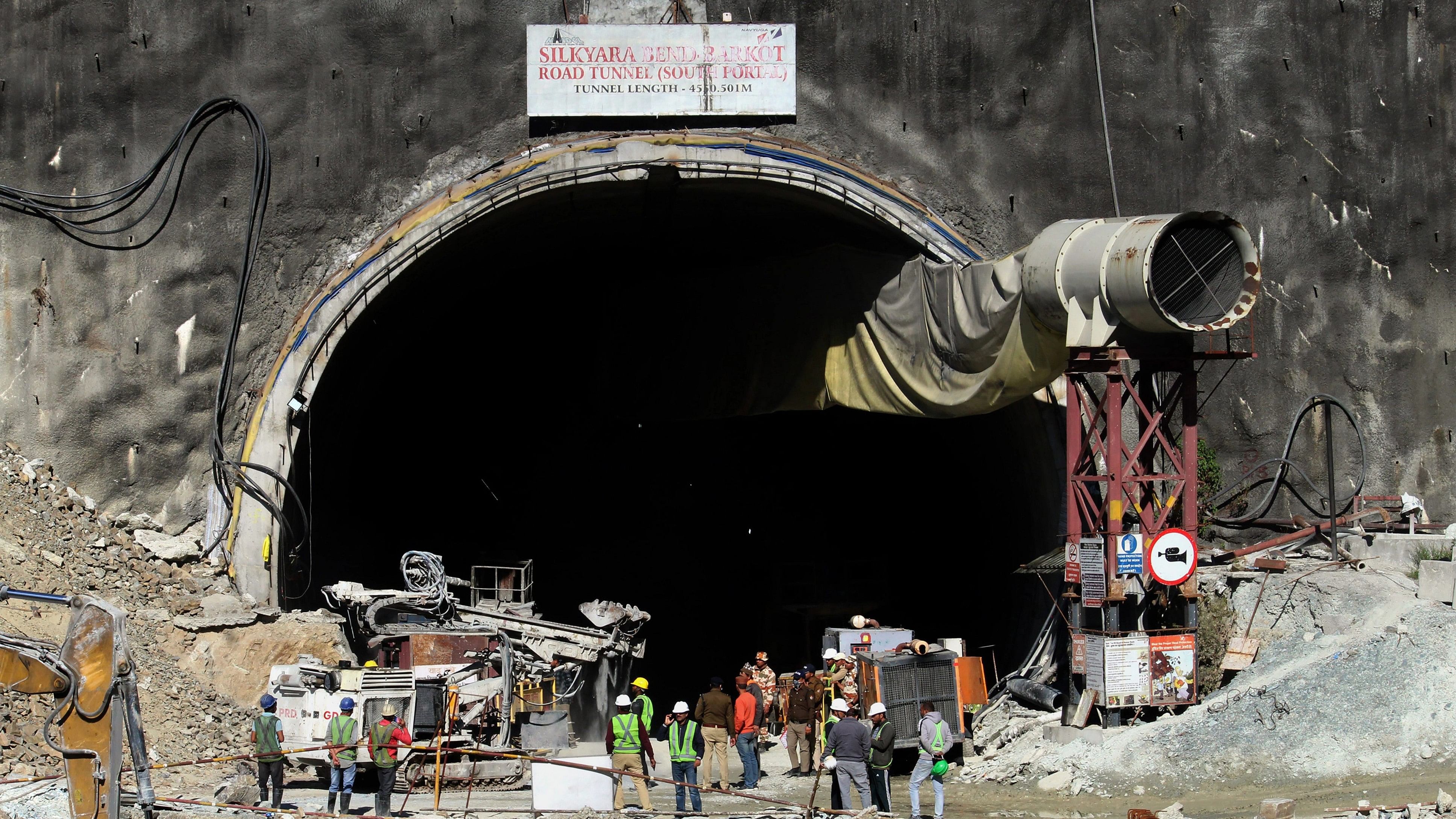 <div class="paragraphs"><p>Security personnel and others at the under-construction tunnel between Silkyara and Dandalgaon on the Brahmakhal-Yamunotri national highway, days after a portion of the tunnel collapsed trapping several workers inside, in Uttarkashi district</p></div>