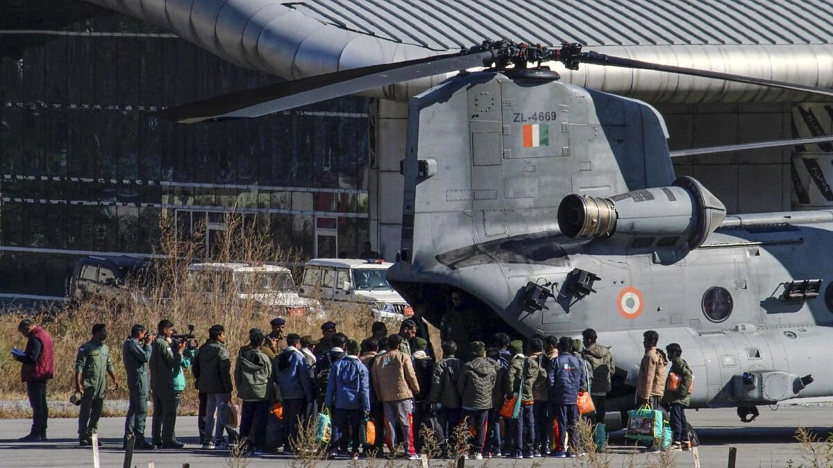 <div class="paragraphs"><p>Rescued workers from the Silkyara Tunnel being airlifted to AIIMS Rishikesh aboard Indian Air Force’s (IAF) Chinook helicopter at the Chinyalisaur airstrip, in Uttarkashi district.</p></div>