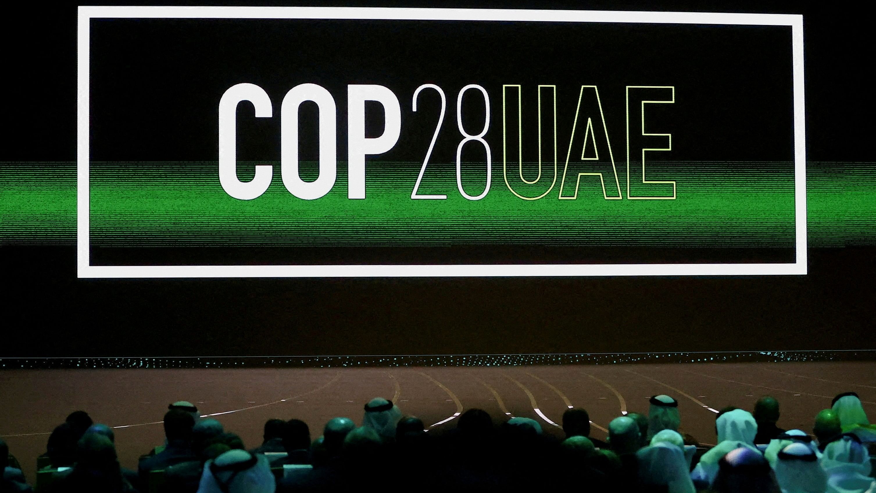 <div class="paragraphs"><p>'Cop28 UAE' logo is displayed on the screen during the opening ceremony of Abu Dhabi Sustainability Week  under the theme of 'United on Climate Action Toward COP28', in Abu Dhabi, UAE, January 16, 2023. </p></div>