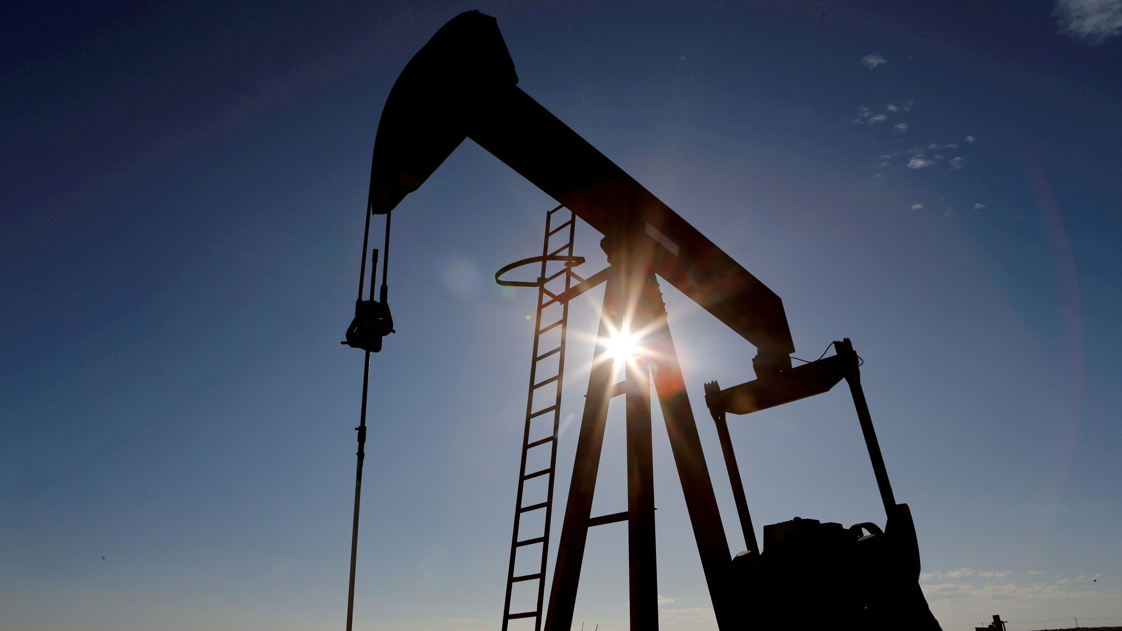 <div class="paragraphs"><p>The sun is seen behind a crude oil pump jack in the Permian Basin in Loving County, Texas.</p></div>