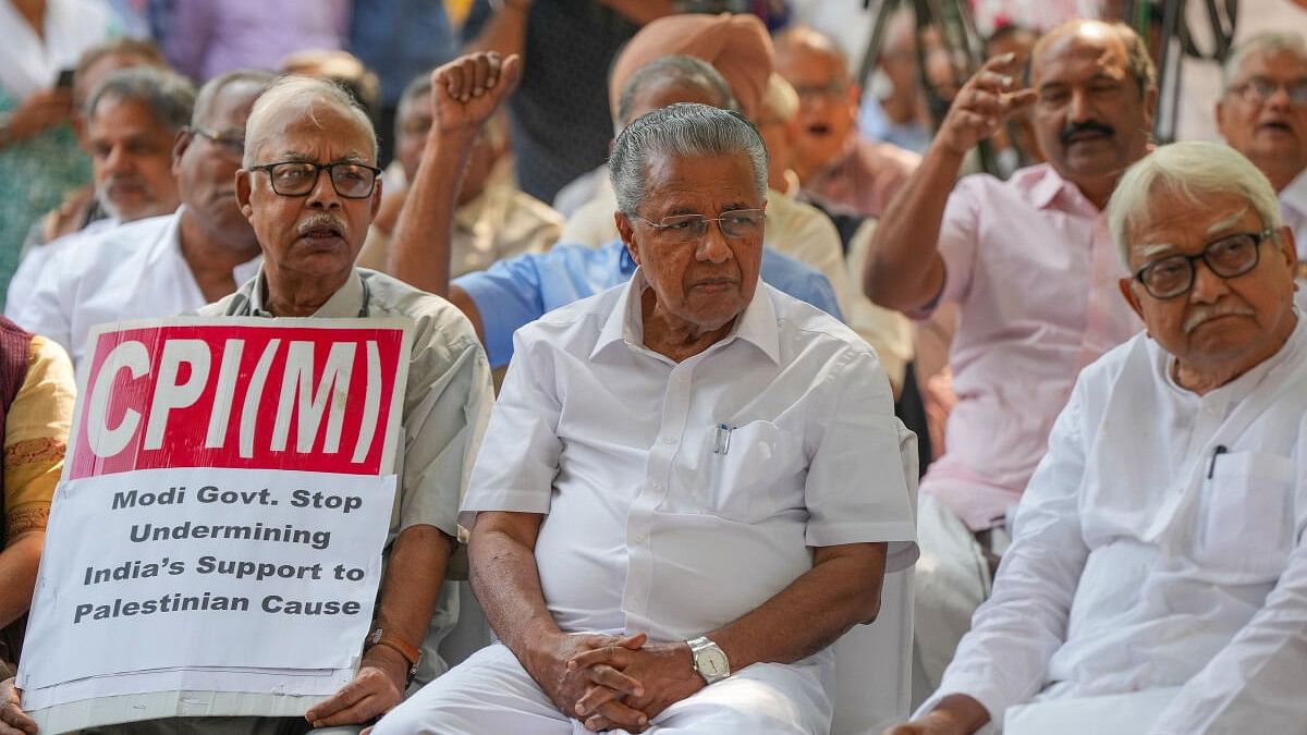 <div class="paragraphs"><p>Kerala CM and CPI(M) leader Pinarayi Vijayan with party leader Biman Bose during a demonstration over Israel-Palestine conflict at party office, in New Delhi.</p></div>