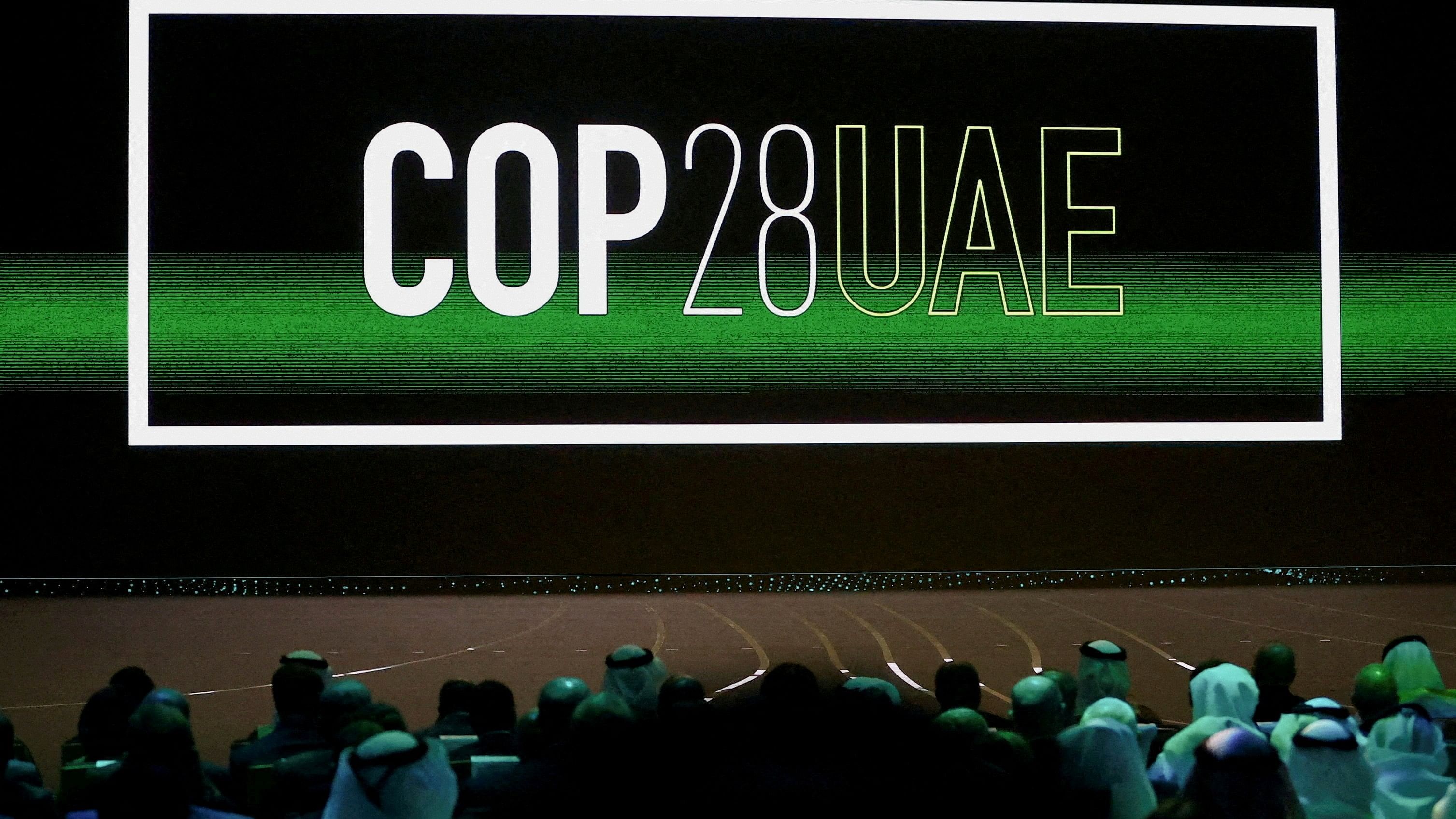 <div class="paragraphs"><p>'Cop28 UAE' logo is displayed on the screen during the opening ceremony of Abu Dhabi Sustainability Week  under the theme of 'United on Climate Action Toward COP28', in Abu Dhabi, UAE.</p></div>