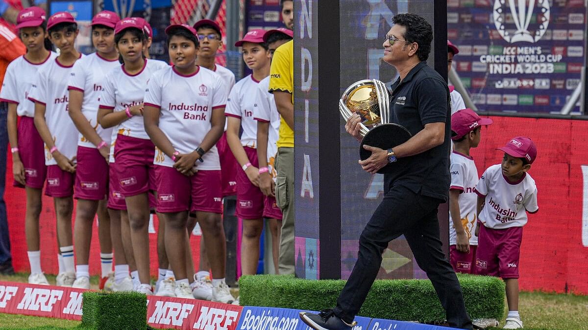 <div class="paragraphs"><p>Indian cricket legend Sachin Tendulkar carrying the World Cup trophy.</p></div>