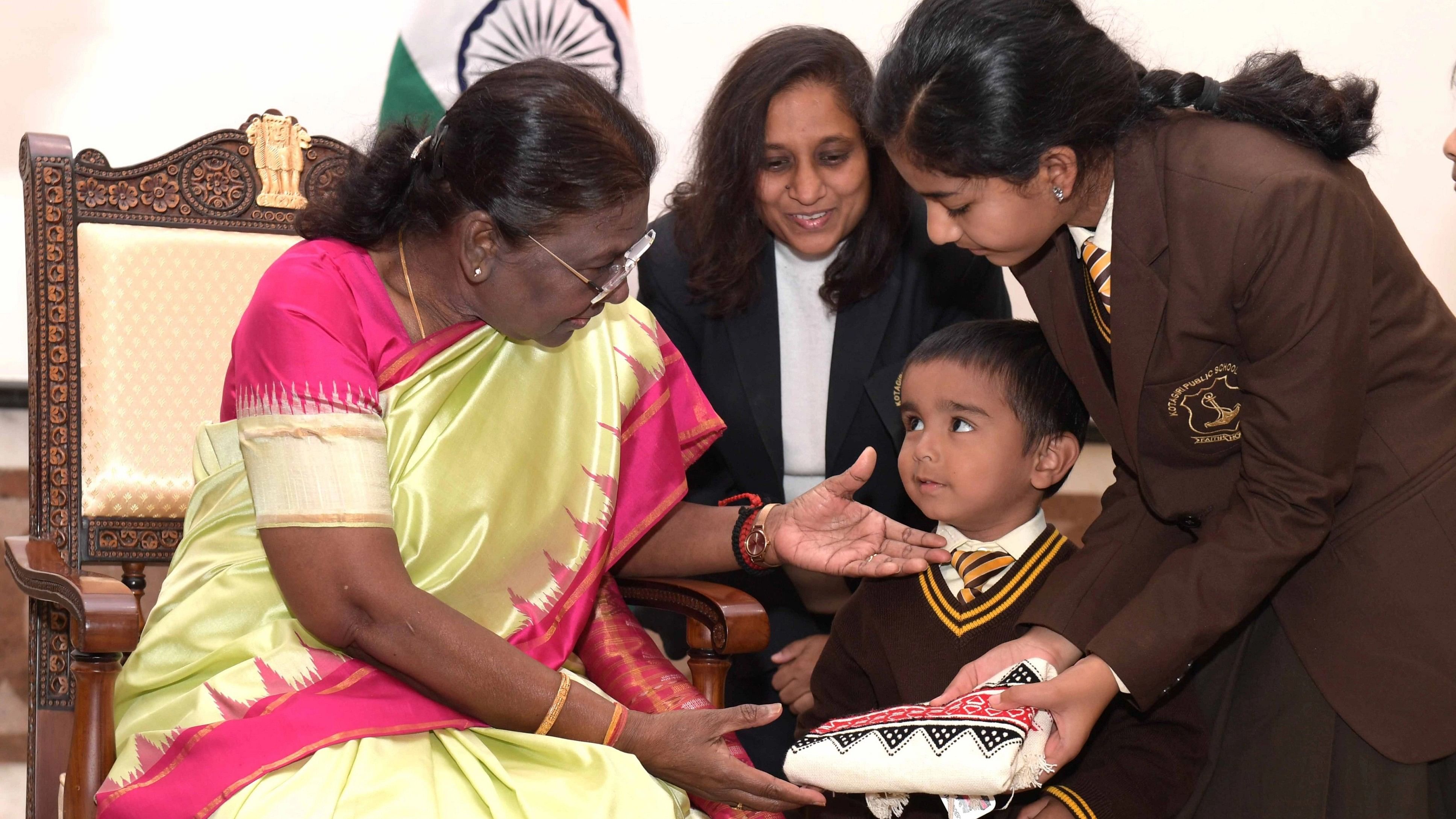 <div class="paragraphs"><p>President Droupadi Murmu greets children on the occasion of&nbsp;Children’s Day on Tuesday at th Rashtrapati Bhavan.</p></div>