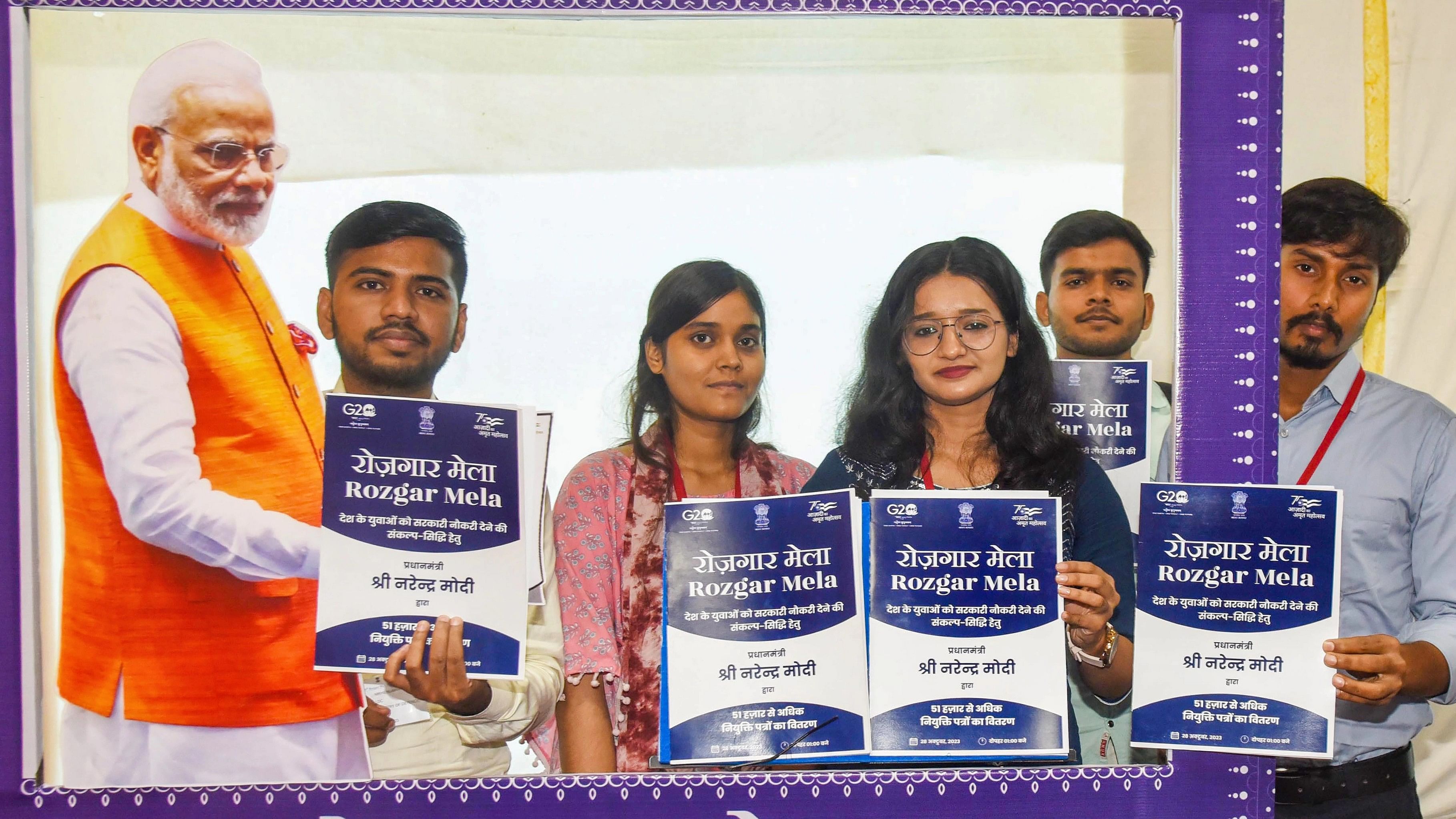 <div class="paragraphs"><p>andidates pose for photos with their appointment letters during 'Rozgar Mela', in Patna, Saturday, Oct. 28, 2023. </p></div>