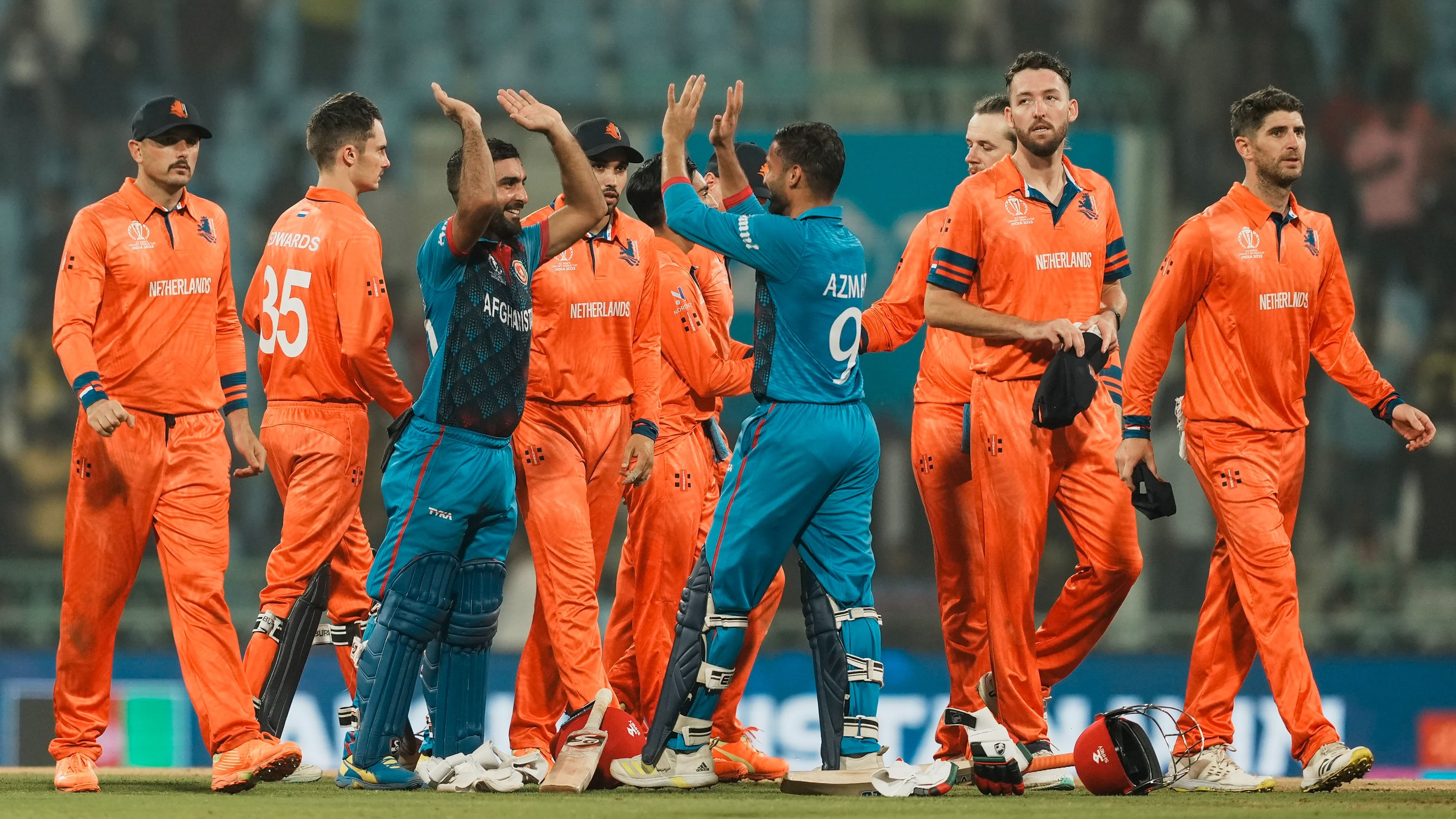 <div class="paragraphs"><p>Afghanistan's batters Hashmatullah Shahidi and Azmatullah Omarzai celebrate after winning the ICC Men's Cricket World Cup 2023 match against Netherlands.</p></div>