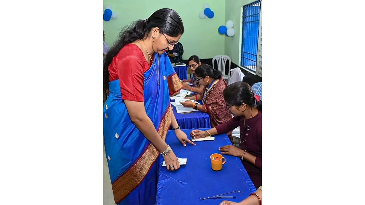 <div class="paragraphs"><p>Chhattisgarh Chief Electoral Officer Reena Baba Saheb Kangale gets her finger marked with indelible ink after casting her vote for the 2nd phase of Chhattisgarh Assembly elections, at a polling station in Raipur district.</p></div>