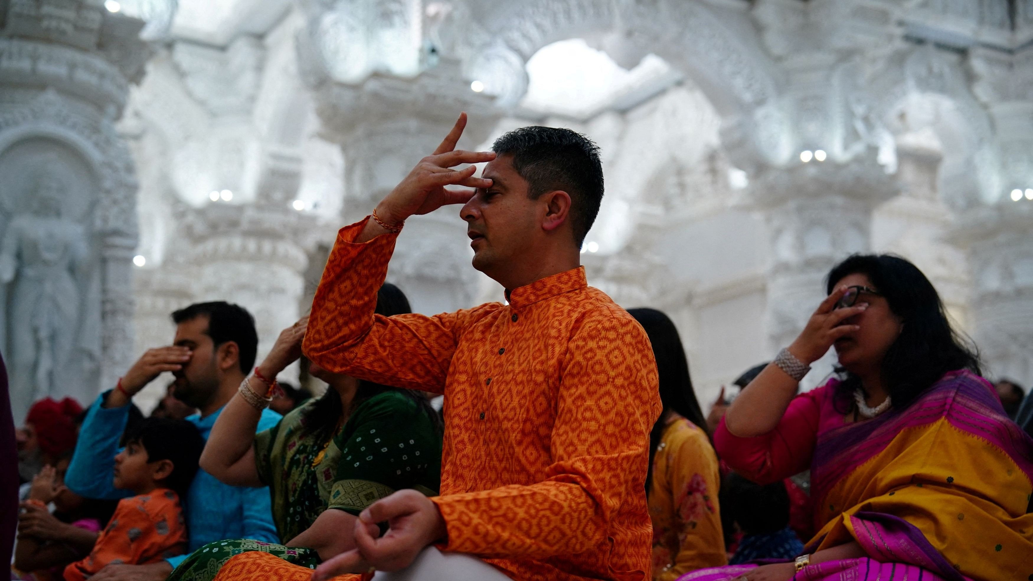 <div class="paragraphs"><p>Devotees take part in a Mahapuja worship ritual during Diwali, the Hindu festival of lights, inside BAPS Swaminarayan Akshardham in Robbinsville, New Jersey, US., November 12, 2023. </p></div>