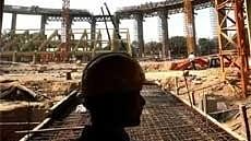 <div class="paragraphs"><p>A worker at the construction site of Shyama Prasad Mukherjee (SPM) Swimming Pool Complex Stadium in New Delhi on Monday. </p></div>
