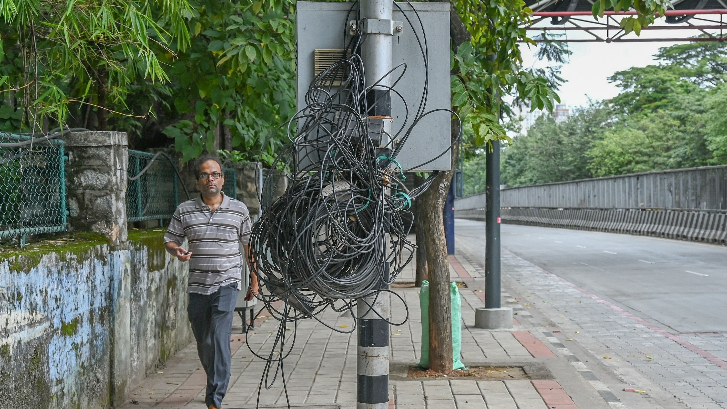 <div class="paragraphs"><p>A&nbsp;cluster&nbsp;of wires and cables&nbsp;entangled on a&nbsp;pole poses a risk to pedestrians. </p></div>