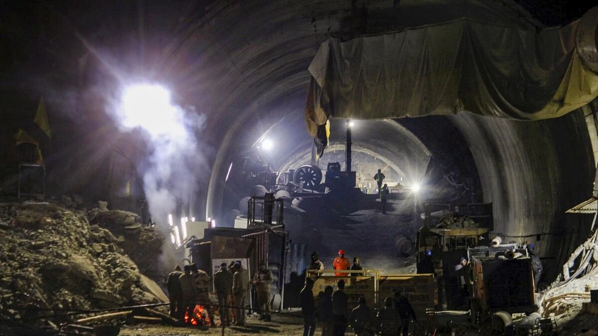 <div class="paragraphs"><p>Uttarkashi: Rescue officials at the entrance of Silkyara Tunnel during the rescue operation of 41 workers trapped inside the under-construction tunnel, in Uttarkashi district, Friday, Nov. 24, 2023.</p></div>