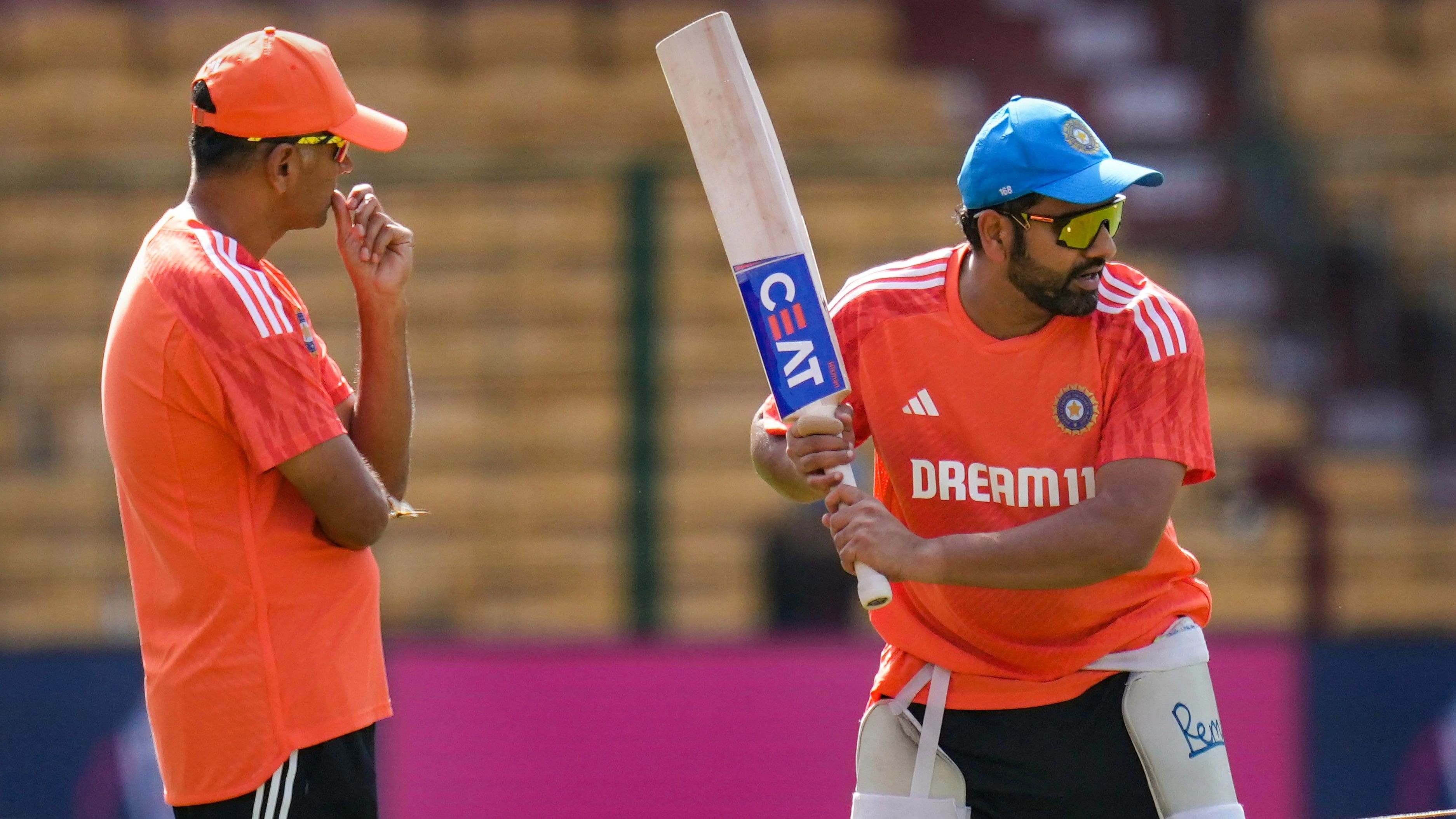 <div class="paragraphs"><p>India's captain Rohit Sharma and head coach Rahul Dravid during a practice session ahead of the ICC Men's Cricket World Cup match between India and Netherlands, at M. Chinnaswamy Stadium, in Bengaluru, Saturday, Nov. 11, 2023. </p></div>