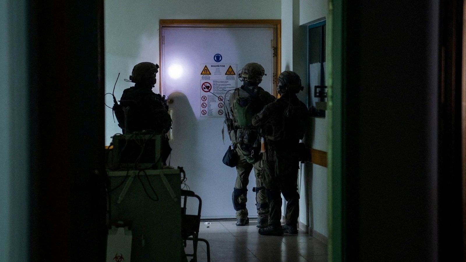 <div class="paragraphs"><p>Israeli soldiers inspect the Al Shifa hospital complex, amid their ground operation against Palestinian Islamist group Hamas, in Gaza City, November 15, 2023.</p></div>