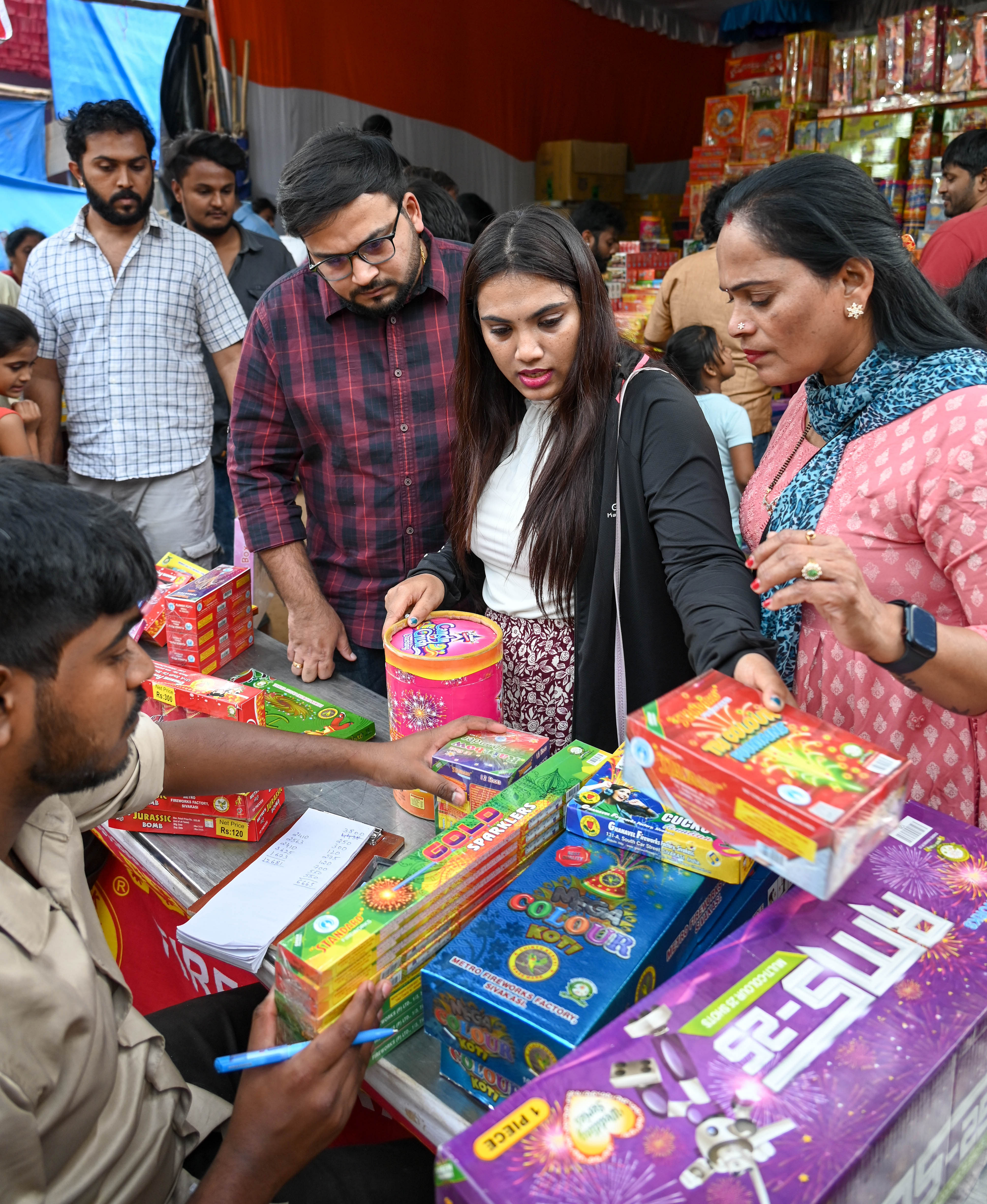 <div class="paragraphs"><p>People are engaged in last-minute shopping for firecrackers at Sheshadripura ground.The state government's restrictions allow firecrackers to be lit only between 8 pm and 10 pm from Friday to Tuesday.&nbsp;</p></div>